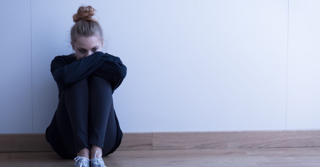 a woman sitting on the floor