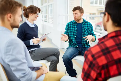 a group of people sitting in a circle