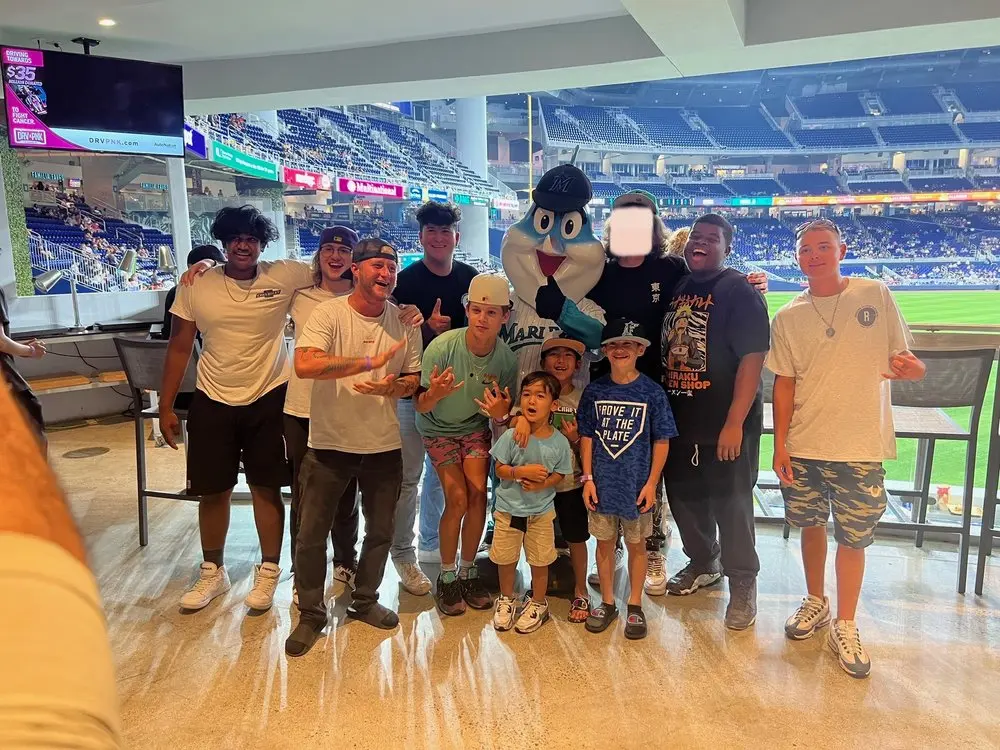 alumni at a marlins game in a skybox